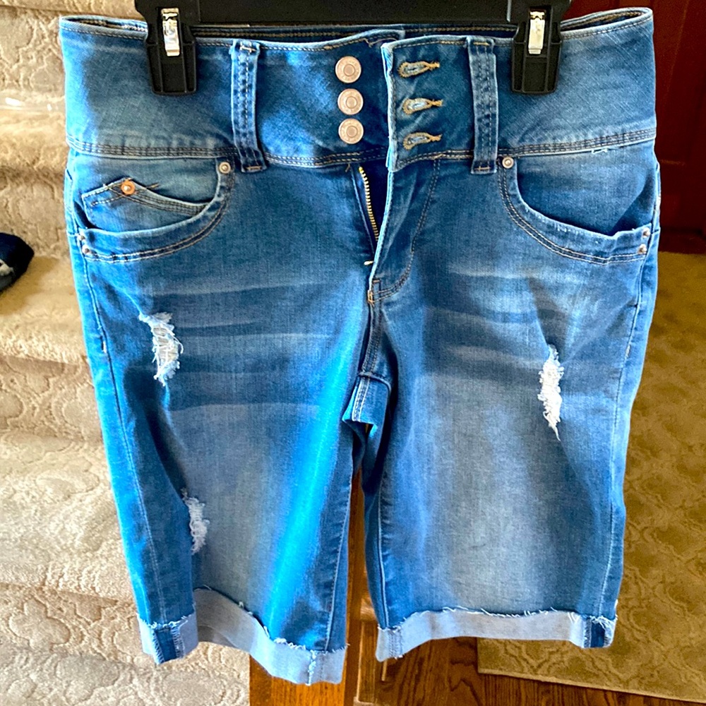 Women’s high-waisted, knee-length, denim jeans from YMI.